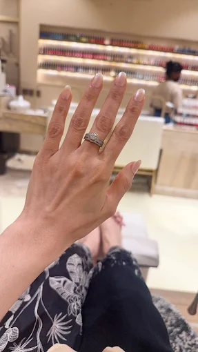 SOHO Salon — nail close-up with polish wall